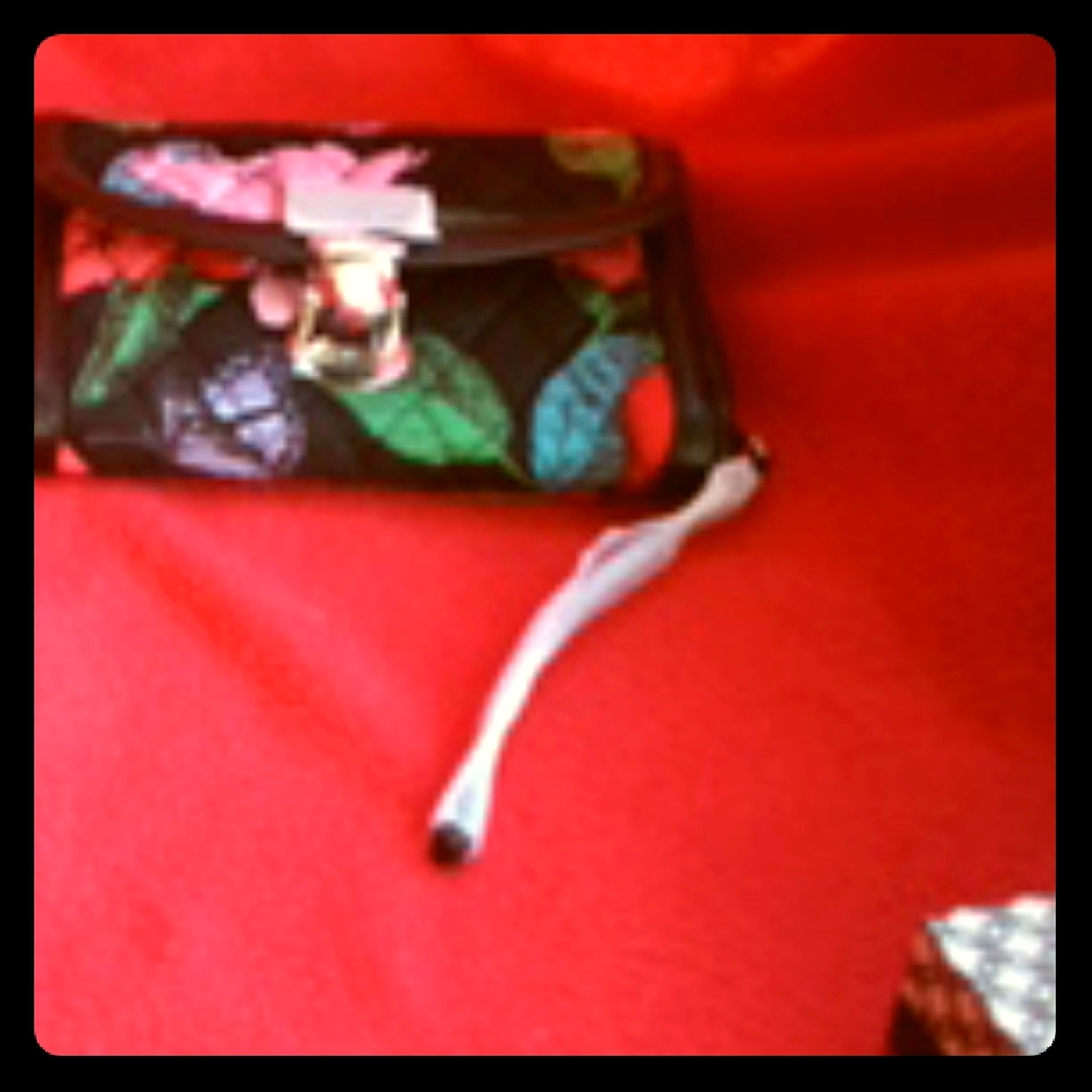 Wristlet; floral in the outside,polka dots inside